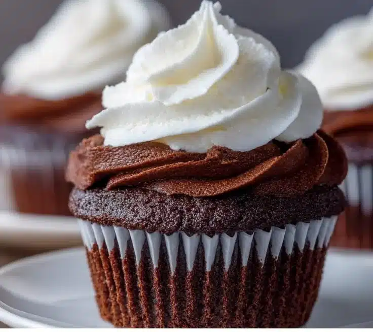 Decadent chocolate cupcake topped with creamy frosting