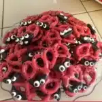 Colorful Ladybug Pretzels decorated with chocolate and candy for a fun snack.