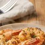 Air Fryer crispy parmesan shrimp served on a plate with seasoning