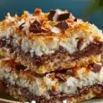 Classic coconut magic bars dessert with layers of coconut and chocolate