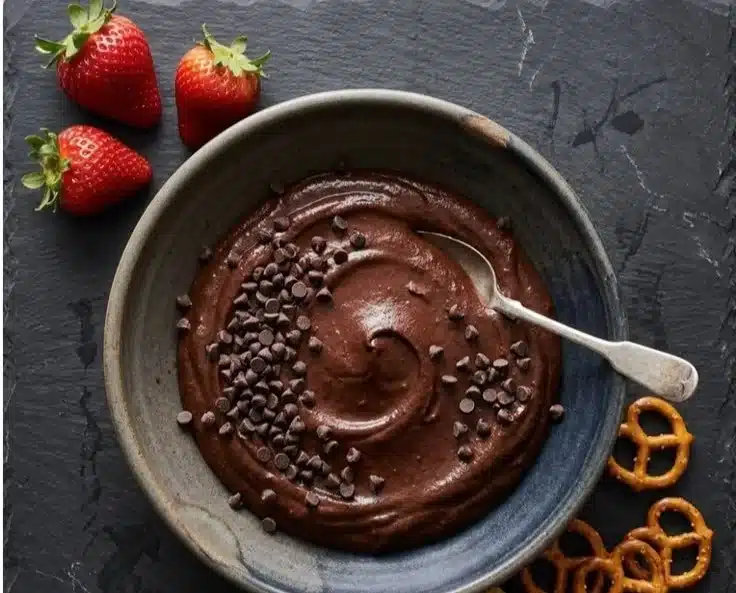 Cottage Cheese Brownie Batter Dip served in a bowl with a spoon