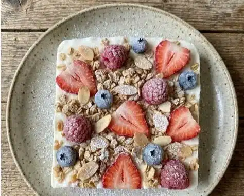 Easy frozen yogurt bark topped with fruits and nuts
