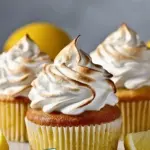 Delicious lemon meringue pie cupcakes topped with fluffy meringue
