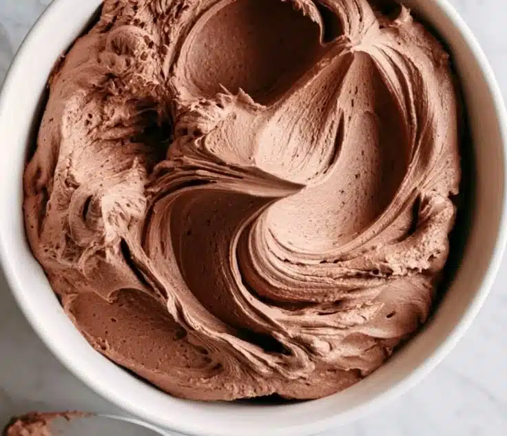 Delicious 2-ingredient chocolate pudding frosting on a cake