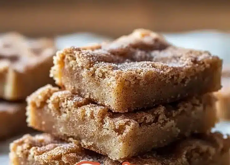 Deliciously soft cinnamon blondies topped with a sprinkle of cinnamon sugar