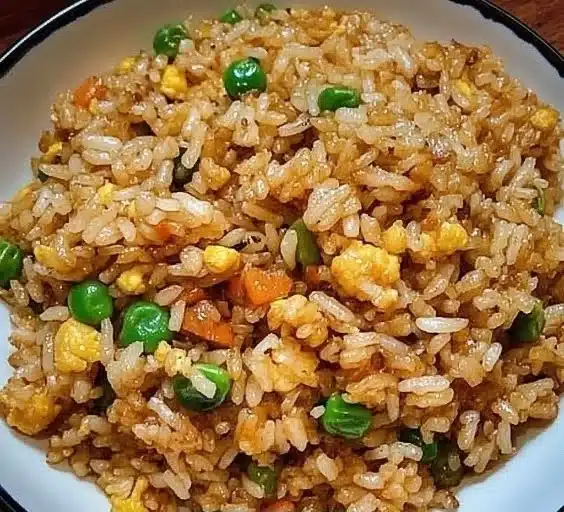 Easy fried rice recipe serving five people with colorful vegetables and eggs.
