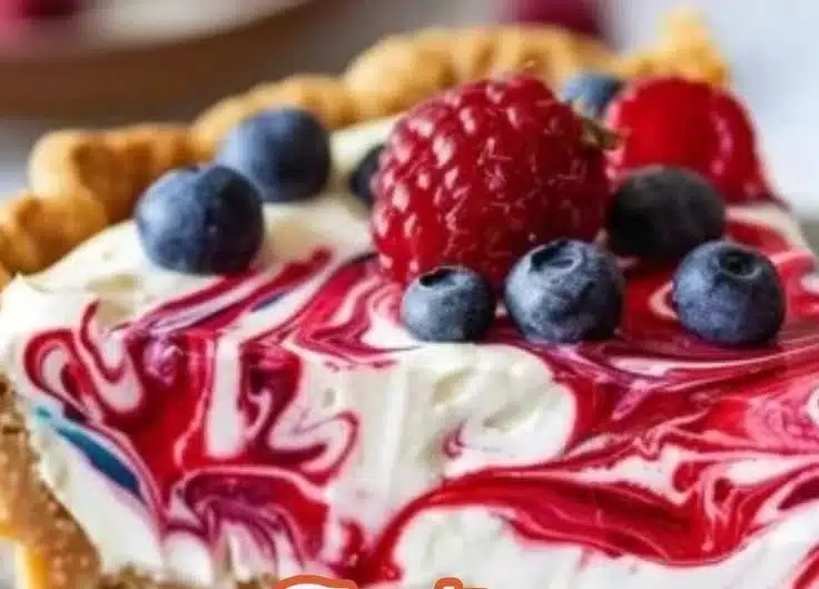 No-bake patriotic berry pie with fresh berries and whipped cream topping.