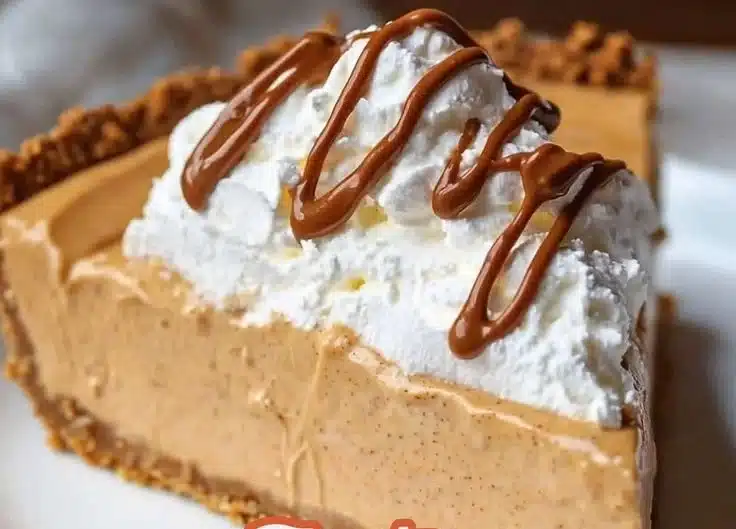 Delicious no bake peanut butter pie topped with whipped cream and chocolate drizzle.