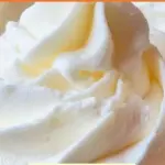 Stabilized whipped cream frosting swirl on a cake for decoration